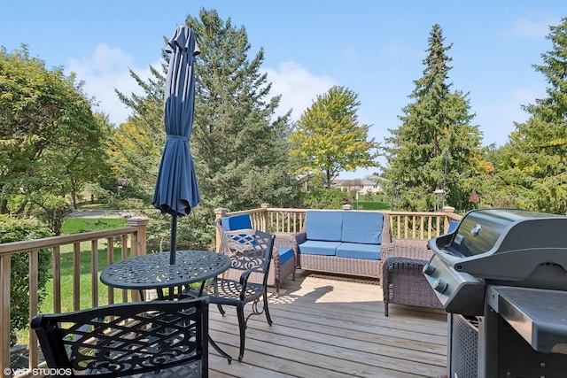 wooden terrace featuring an outdoor hangout area and grilling area