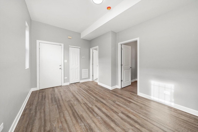 spare room featuring hardwood / wood-style floors