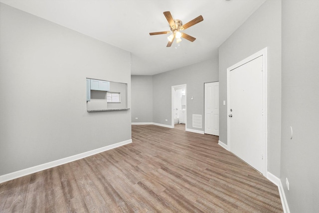 unfurnished living room featuring light hardwood / wood-style floors and ceiling fan