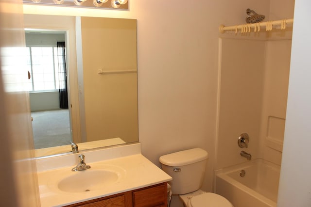 full bathroom featuring shower / bathing tub combination, vanity, and toilet