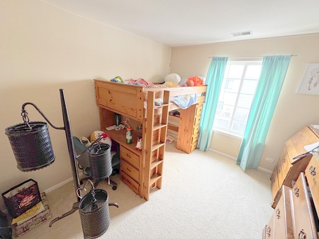 bedroom featuring light carpet