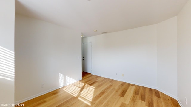 empty room featuring hardwood / wood-style flooring