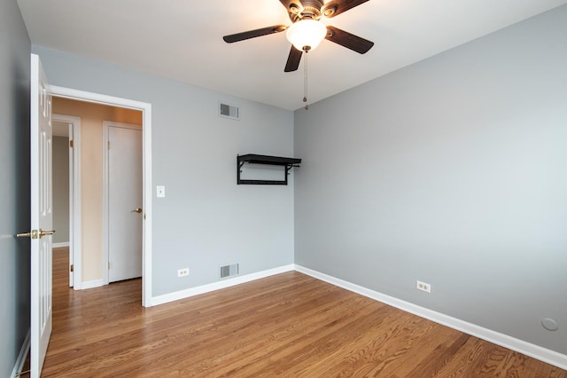 spare room with ceiling fan and light hardwood / wood-style flooring