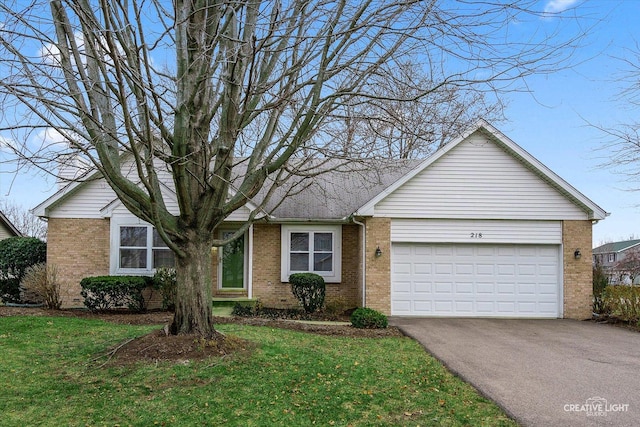 single story home with a garage and a front lawn