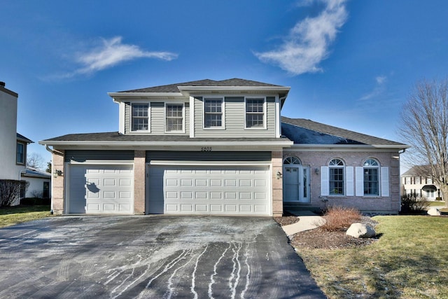 front of property with a garage