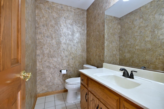 bathroom featuring tile patterned flooring, vanity, and toilet