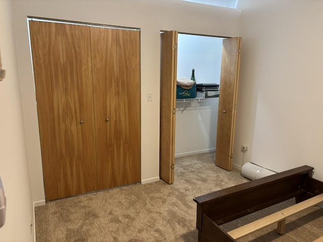 bedroom featuring light carpet