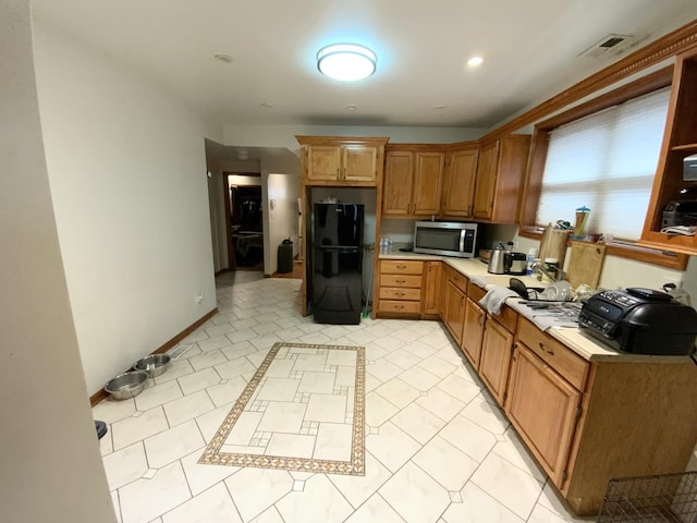 kitchen featuring black fridge