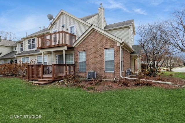 back of property with central air condition unit, a wooden deck, and a yard