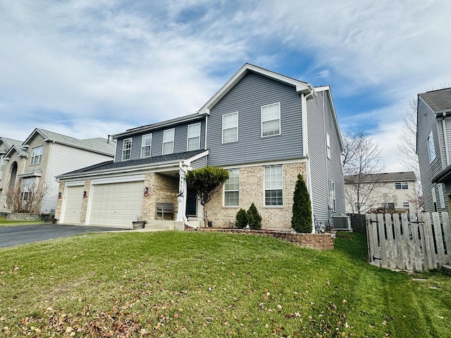 front of property with a front lawn and a garage