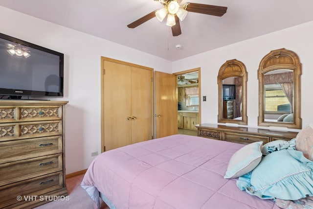 bedroom featuring light carpet, a closet, and ceiling fan