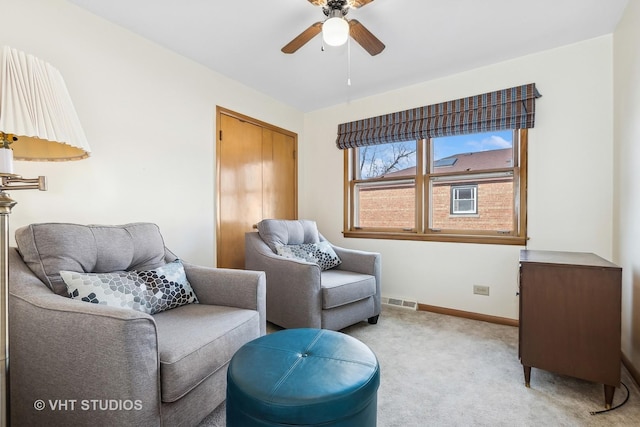 sitting room with light carpet and ceiling fan