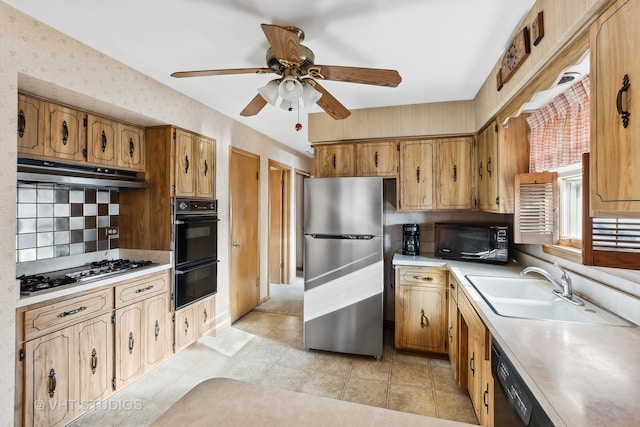 kitchen featuring decorative backsplash, ceiling fan, sink, black appliances, and light tile patterned flooring