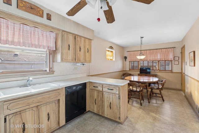 kitchen featuring ceiling fan, dishwasher, sink, kitchen peninsula, and pendant lighting