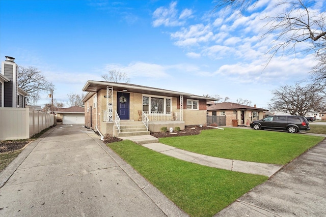 view of front of home featuring covered porch, a garage, a front lawn, and an outdoor structure