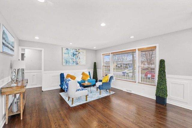 sitting room featuring dark wood-type flooring