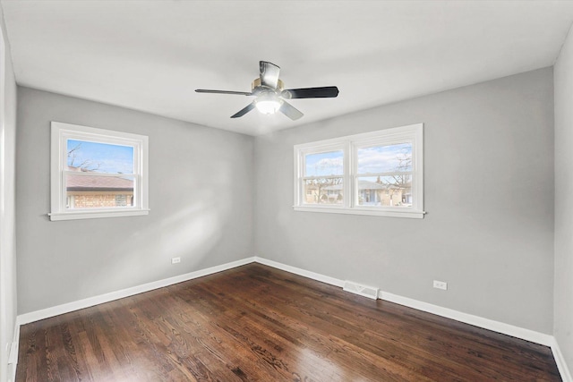 empty room featuring hardwood / wood-style flooring and ceiling fan