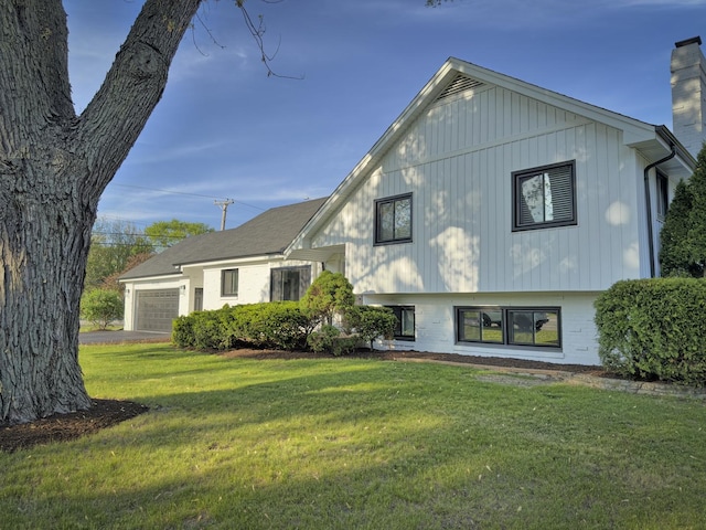 7S135 Clover Ct, Naperville, IL 60540 - split level home with an attached garage, a front yard, and a chimney