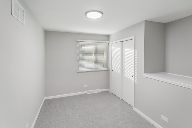 7S135 Clover Ct, Naperville, IL 60540 - unfurnished bedroom with a closet, baseboards, and carpet flooring