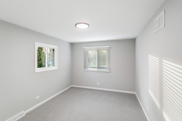 7S135 Clover Ct, Naperville, IL 60540 - empty room featuring healthy amount of natural light, carpet flooring, and baseboards