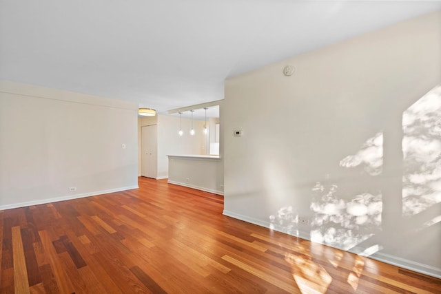 unfurnished room featuring wood-type flooring