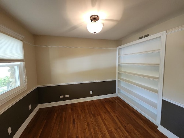 empty room featuring dark hardwood / wood-style floors