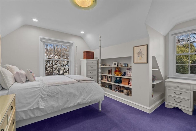 carpeted bedroom featuring multiple windows and vaulted ceiling