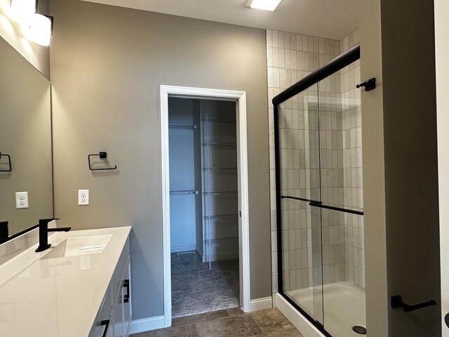 2523 Marble, Normal, IL 61761 - full bathroom with a stall shower, baseboards, a spacious closet, and vanity