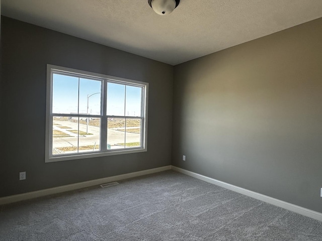 2523 Marble, Normal, IL 61761 - unfurnished room with carpet flooring, baseboards, and a textured ceiling