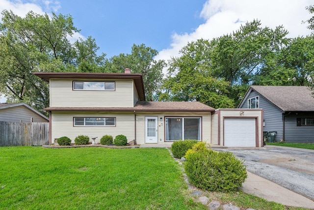 view of front facade with a front yard and a garage