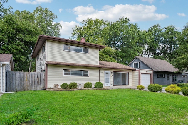 view of front of property with a front lawn and a garage