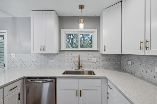 kitchen with white cabinets, dishwasher, sink, and hanging light fixtures