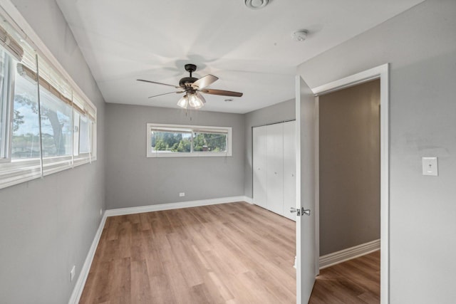 unfurnished bedroom featuring light hardwood / wood-style flooring and ceiling fan