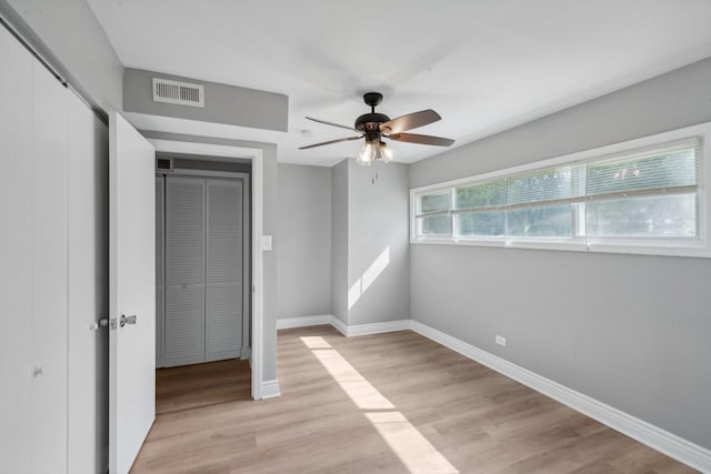 unfurnished bedroom featuring ceiling fan and light hardwood / wood-style floors