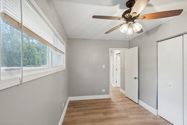 unfurnished bedroom featuring light hardwood / wood-style floors and ceiling fan