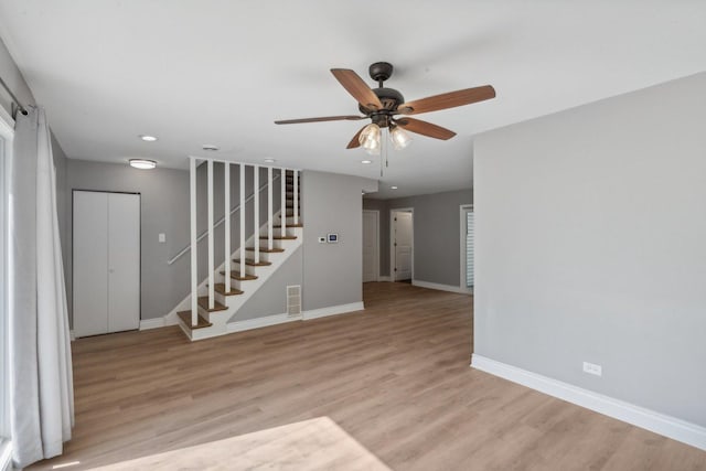 unfurnished room featuring ceiling fan and light hardwood / wood-style floors