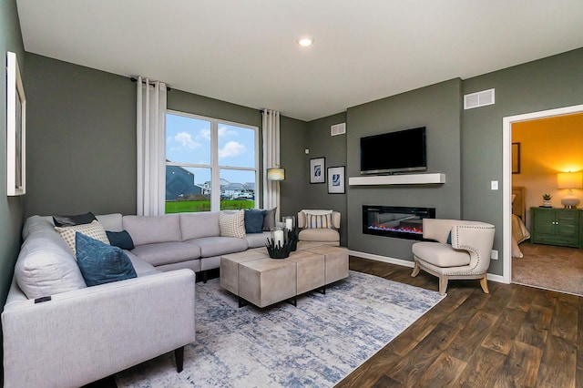 living room featuring dark hardwood / wood-style flooring