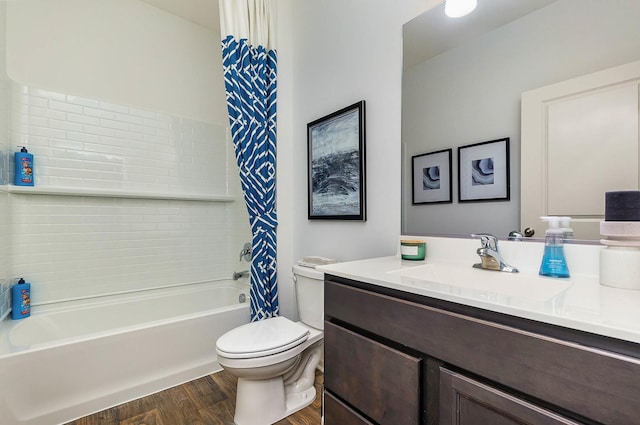 full bathroom with hardwood / wood-style floors, vanity, shower / bath combo, and toilet