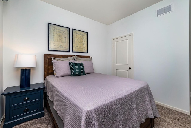 bedroom with dark carpet