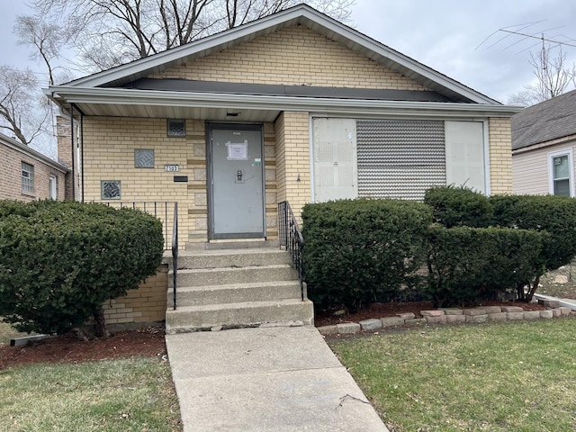 bungalow with a front lawn