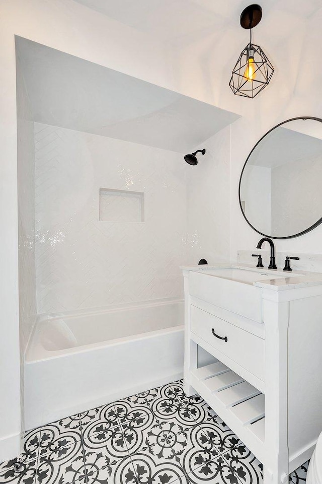 bathroom with vanity, tile patterned floors, and washtub / shower combination