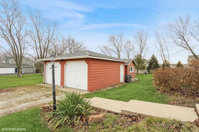 garage with a yard