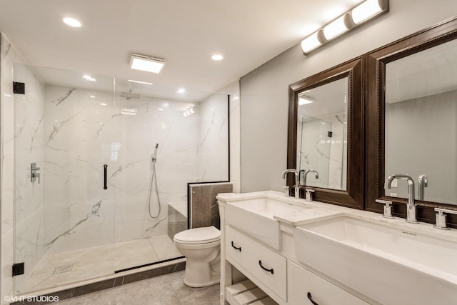 bathroom featuring toilet, vanity, and walk in shower