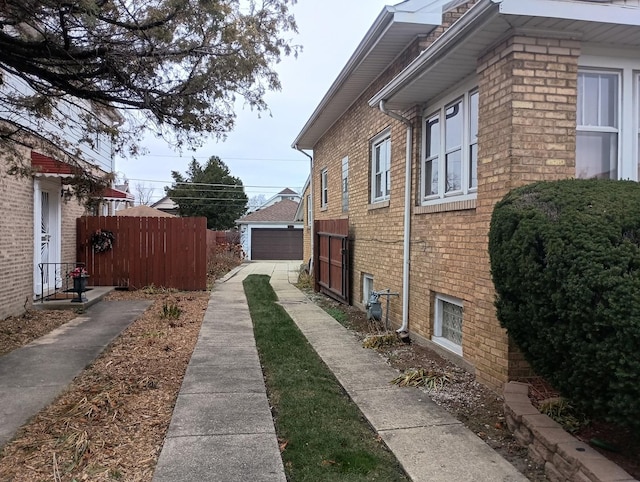 view of property exterior with an outbuilding and a garage