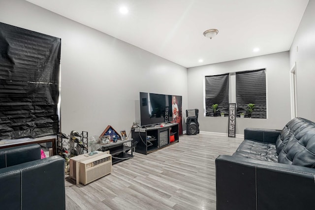 living room with light hardwood / wood-style flooring