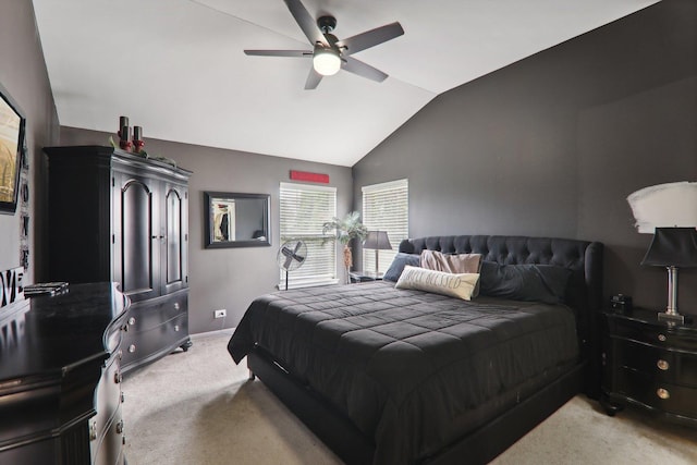 carpeted bedroom with ceiling fan and lofted ceiling