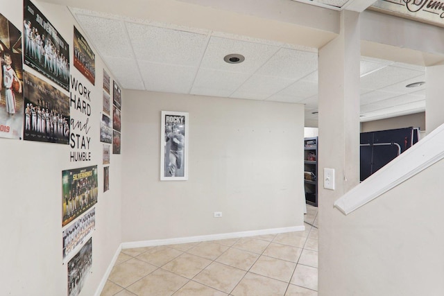 interior space featuring a drop ceiling