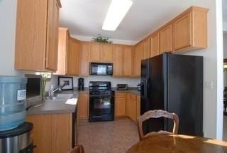 kitchen featuring sink and black appliances