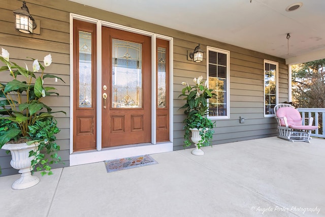 entrance foyer with a chandelier, dark hardwood / wood-style floors, and ornamental molding