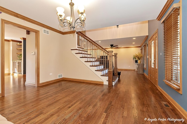 living room featuring ceiling fan, hardwood / wood-style floors, and crown molding